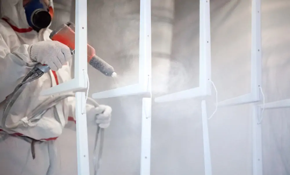 Parts being powdered coated in white