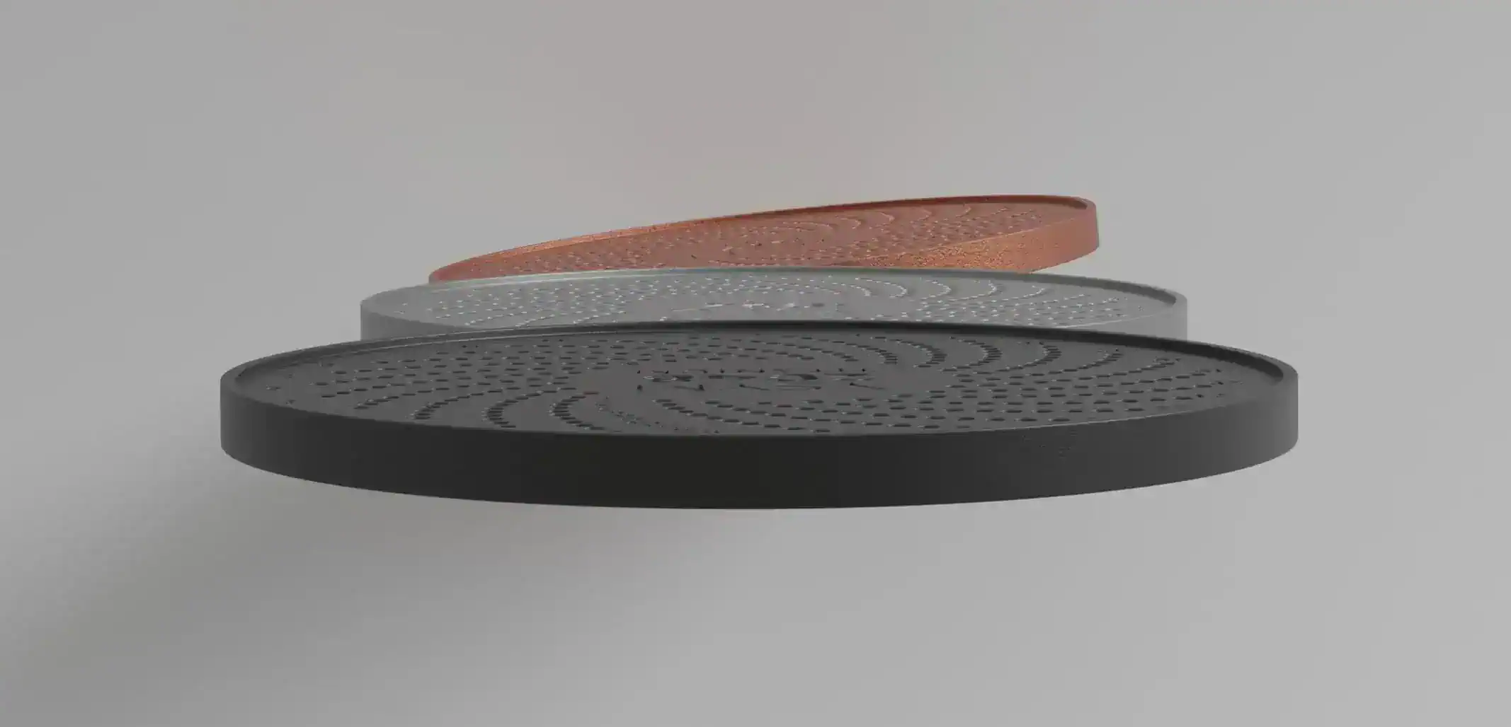 Side view of Yoseyomo's ultra-thin vaults in titanium, stainless steel, and copper finishes