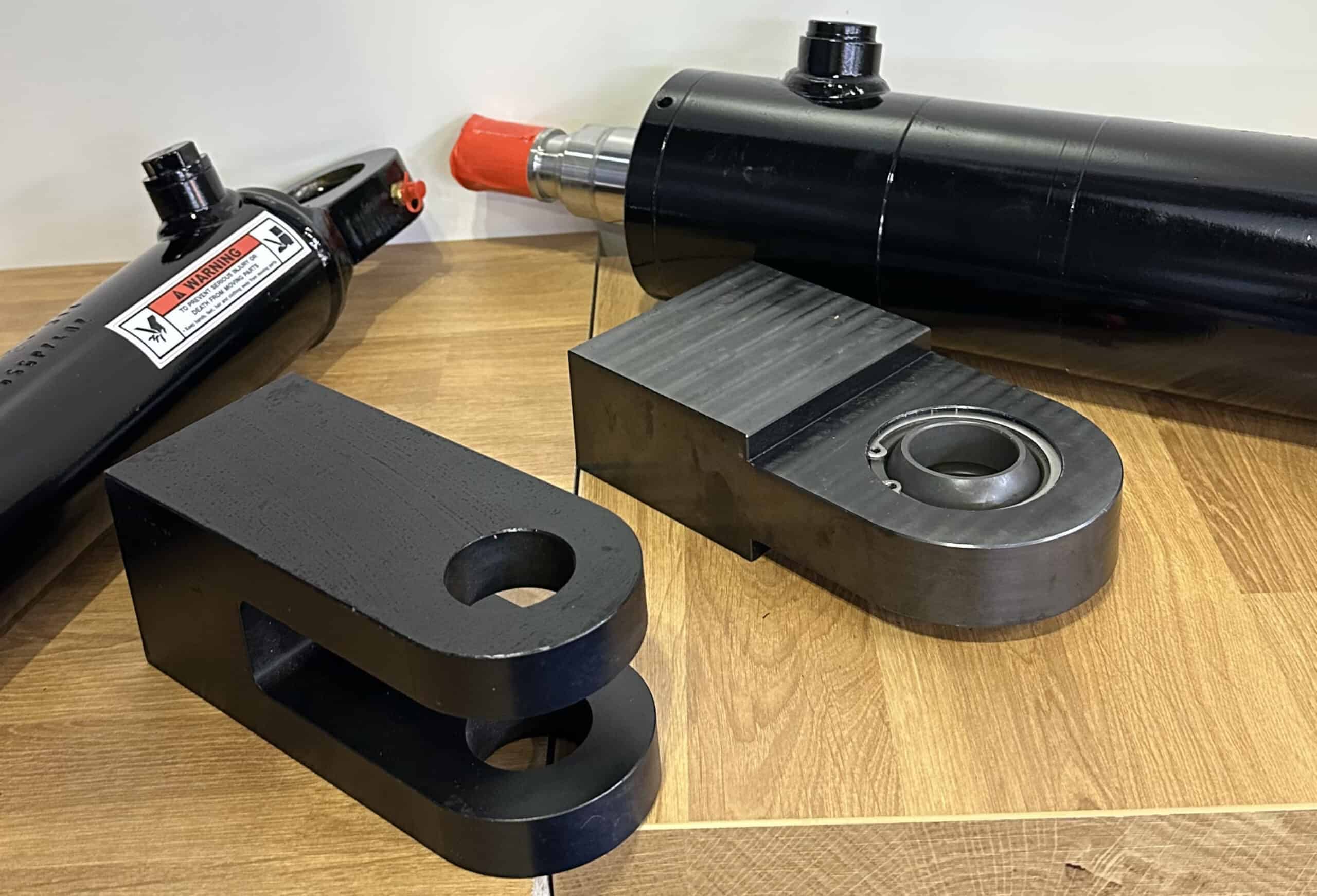CNC machined black metal component of a marine hydraulic cylinder